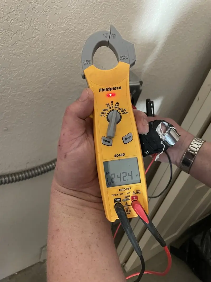 Voltage testing with clamp meter during Recessed Lighting Installation in Lithia Springs